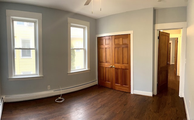 47 Beacon St, Hamden, CT 06514 - unfurnished bedroom featuring dark wood-style floors, baseboard heating, and multiple windows