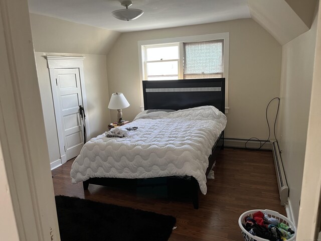 47 Beacon St, Hamden, CT 06514 - bedroom with vaulted ceiling, dark wood-type flooring, baseboard heating, and baseboards