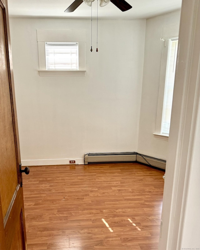47 Beacon St, Hamden, CT 06514 - empty room featuring healthy amount of natural light, ceiling fan, and light wood-type flooring