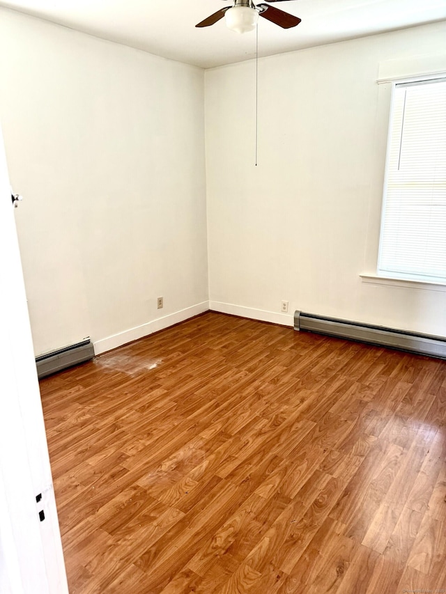 47 Beacon St, Hamden, CT 06514 - unfurnished room with a baseboard radiator, ceiling fan, wood finished floors, and baseboards
