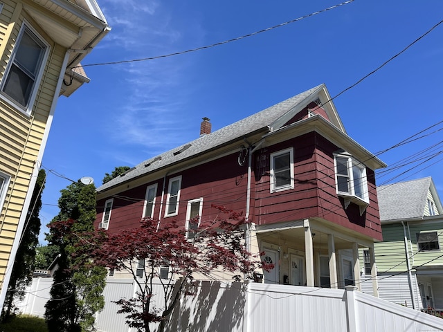 47 Beacon St, Hamden, CT 06514 - view of home's exterior with a chimney