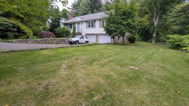 11 Twin Brooks Ln, Fairfield, CT 06824 - view of grassy yard featuring an attached garage and driveway