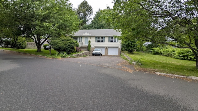 11 Twin Brooks Ln, Fairfield, CT 06824 - view of front facade featuring asphalt driveway, a garage, and a front yard