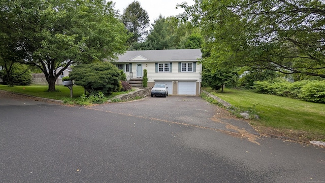 11 Twin Brooks Ln, Fairfield, CT 06824 - raised ranch featuring driveway, an attached garage, and a front lawn