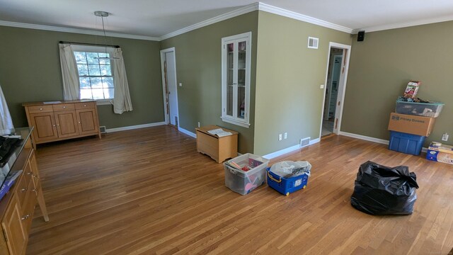 11 Twin Brooks Ln, Fairfield, CT 06824 - unfurnished living room featuring wood finished floors, baseboards, and crown molding