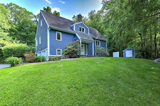 76 Crestwood Rd, Bethany, CT 06524 - view of front of home with a chimney, an attached garage, a front lawn, and a shingled roof