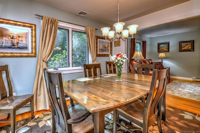 76 Crestwood Rd, Bethany, CT 06524 - dining room featuring wood finished floors, a chandelier, baseboards, and baseboard heating