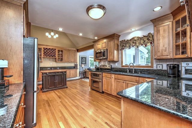 76 Crestwood Rd, Bethany, CT 06524 - kitchen with appliances with stainless steel finishes, a sink, light wood-style floors, backsplash, and recessed lighting