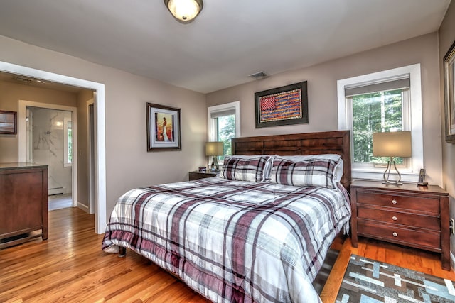 76 Crestwood Rd, Bethany, CT 06524 - bedroom featuring baseboard heating and wood finished floors