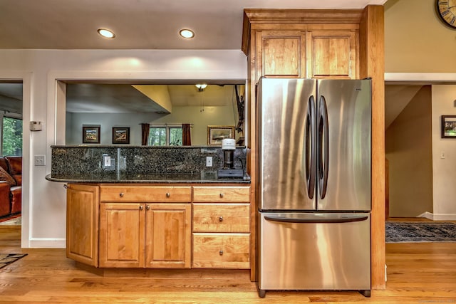 76 Crestwood Rd, Bethany, CT 06524 - kitchen with freestanding refrigerator, light wood-style flooring, brown cabinetry, dark stone countertops, and recessed lighting