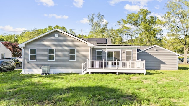 48 Blakeslee Ave, North Haven, CT 06473 - rear view of property with solar panels, a deck, a yard, and cooling unit