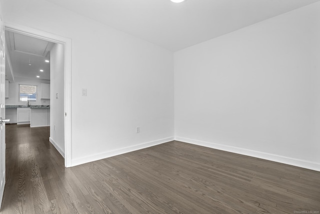 48 Blakeslee Ave, North Haven, CT 06473 - spare room featuring attic access, dark wood-style flooring, and baseboards