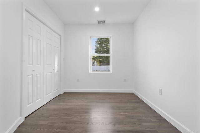 48 Blakeslee Ave, North Haven, CT 06473 - unfurnished bedroom with dark wood-type flooring, baseboards, and a closet