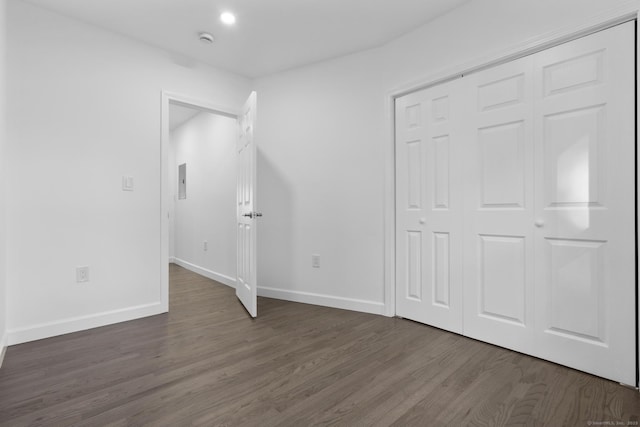 48 Blakeslee Ave, North Haven, CT 06473 - unfurnished bedroom with dark wood-type flooring, baseboards, and a closet