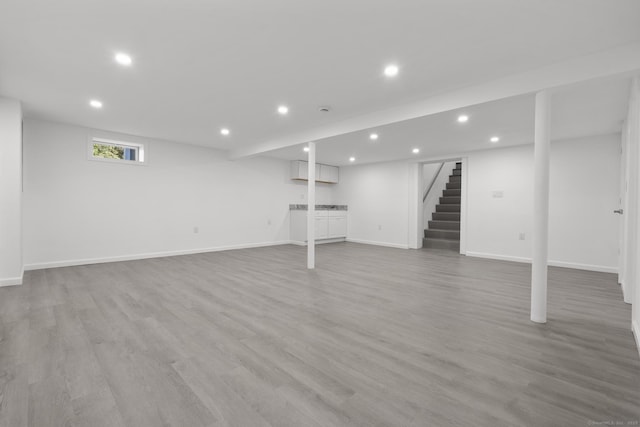 48 Blakeslee Ave, North Haven, CT 06473 - below grade area with recessed lighting, stairway, light wood finished floors, and baseboards