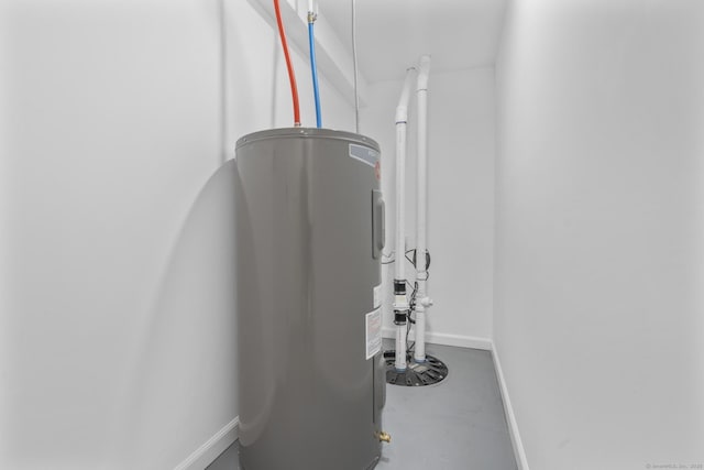 48 Blakeslee Ave, North Haven, CT 06473 - detailed view of electric water heater, finished concrete flooring, and baseboards