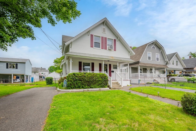 273 Piedmont St, Waterbury, CT 06706 - view of front of property featuring a porch, a front lawn, cooling unit, and a shingled roof