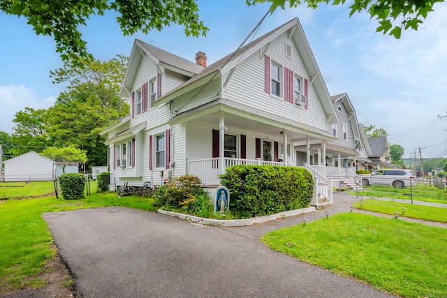 273 Piedmont St, Waterbury, CT 06706 - view of side of home featuring a porch and a chimney