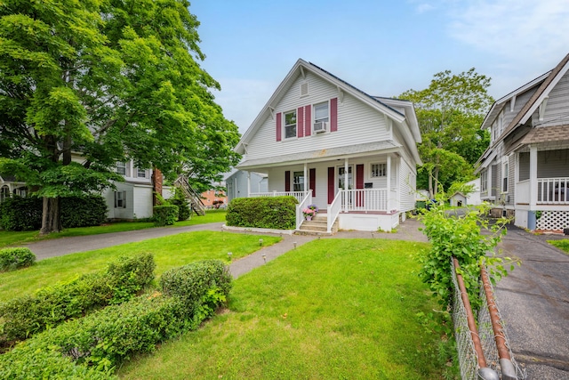 273 Piedmont St, Waterbury, CT 06706 - view of front of house with a porch, a front lawn, and cooling unit