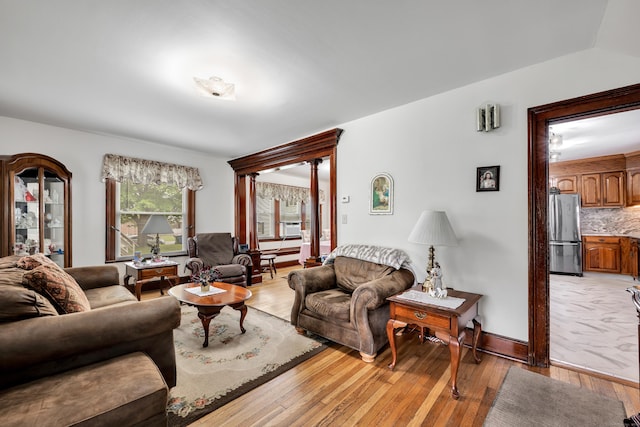 273 Piedmont St, Waterbury, CT 06706 - living area with light wood-style flooring and cooling unit