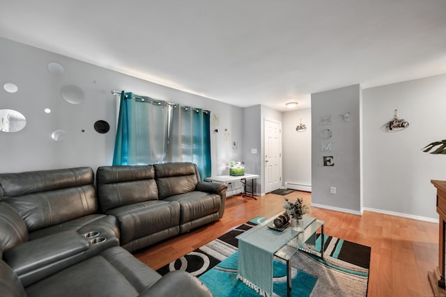 68 Round Tree Dr Unit 9, Naugatuck, CT 06770 - living room featuring a baseboard radiator, light wood-style flooring, and baseboards