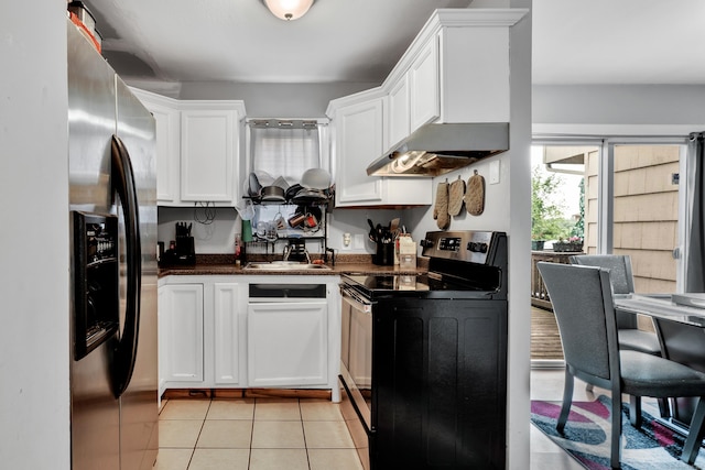 68 Round Tree Dr Unit 9, Naugatuck, CT 06770 - kitchen with electric range oven, stainless steel fridge, dark countertops, white cabinetry, and light tile patterned floors