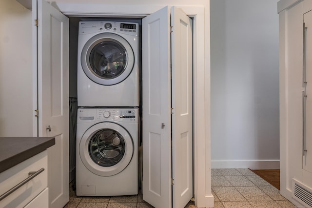 24 River Rd, Deep River, CT 06417 - washroom with stacked washer and clothes dryer and baseboards