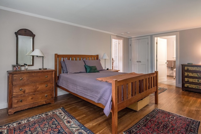 24 River Rd, Deep River, CT 06417 - bedroom with dark wood-style floors, crown molding, baseboards, and connected bathroom
