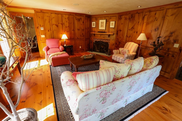 289 Woodchuck Ln, Harwinton, CT 06791 - living area featuring hardwood / wood-style flooring, a fireplace, wooden walls, recessed lighting, and ornamental molding