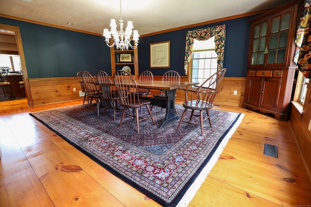 289 Woodchuck Ln, Harwinton, CT 06791 - dining room with plenty of natural light, wainscoting, hardwood / wood-style floors, crown molding, and a chandelier