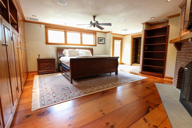 289 Woodchuck Ln, Harwinton, CT 06791 - bedroom with a fireplace, crown molding, light wood finished floors, and recessed lighting