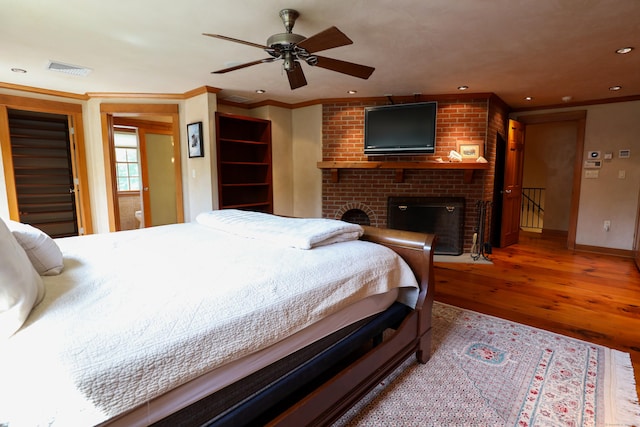289 Woodchuck Ln, Harwinton, CT 06791 - bedroom featuring wood finished floors, a fireplace, crown molding, and recessed lighting