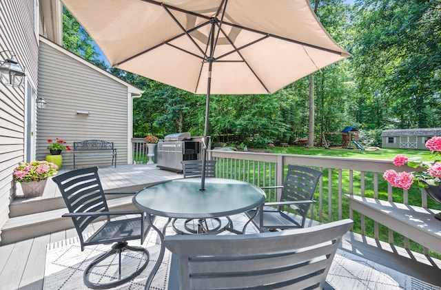 67 Old Farms Rd, Glastonbury, CT 06073 - view of patio / terrace featuring outdoor dining area, a playground, a wooden deck, and grilling area