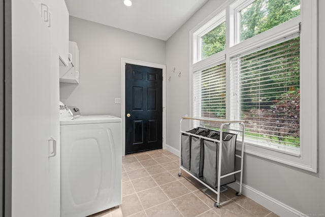 67 Old Farms Rd, Glastonbury, CT 06073 - laundry room with washing machine and dryer, light tile patterned floors, and cabinet space