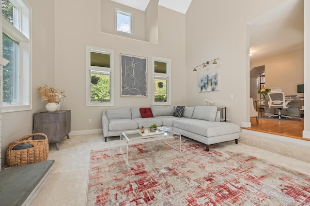 67 Old Farms Rd, Glastonbury, CT 06073 - carpeted living area with a towering ceiling and an office area