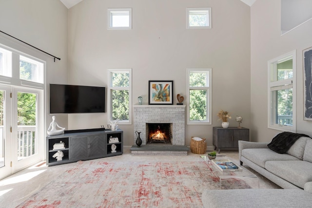 67 Old Farms Rd, Glastonbury, CT 06073 - living area with high vaulted ceiling, a fireplace, and carpet flooring