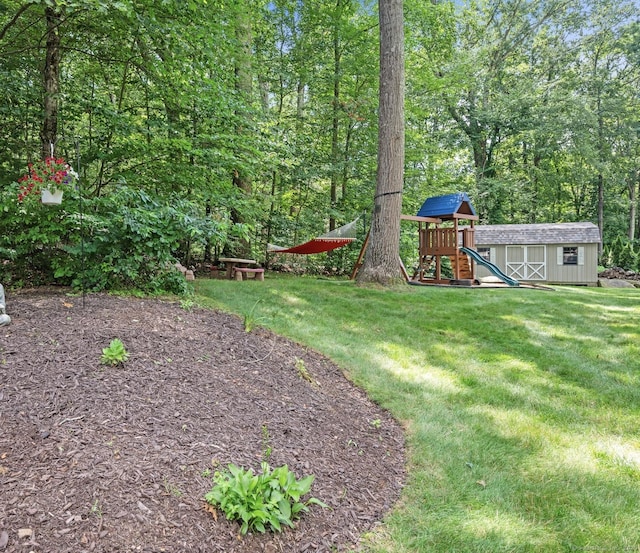 67 Old Farms Rd, Glastonbury, CT 06073 - view of green lawn featuring a playground and a storage shed