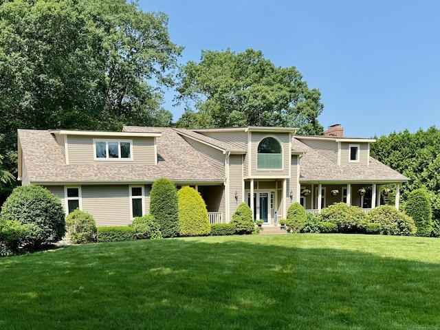67 Old Farms Rd, Glastonbury, CT 06073 - view of front of property featuring a front yard, roof with shingles, and a chimney