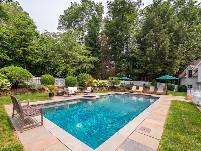 8 Cobbs Mill Rd, Wilton, CT 06897 - view of swimming pool featuring a patio area, view of scattered trees, and a pool with connected hot tub