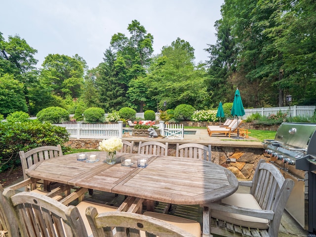 8 Cobbs Mill Rd, Wilton, CT 06897 - view of patio / terrace with outdoor dining space and view of wooded area
