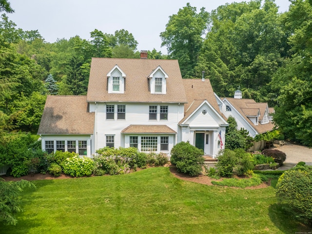 8 Cobbs Mill Rd, Wilton, CT 06897 - view of front of home featuring a front yard, a chimney, and a shingled roof