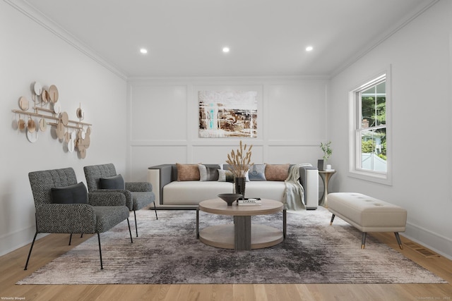 45 Robin Cir, Fairfield, CT 06824 - living area with ornamental molding, wood finished floors, recessed lighting, baseboards, and a decorative wall