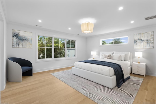 45 Robin Cir, Fairfield, CT 06824 - bedroom with crown molding, multiple windows, baseboards, wood finished floors, and recessed lighting