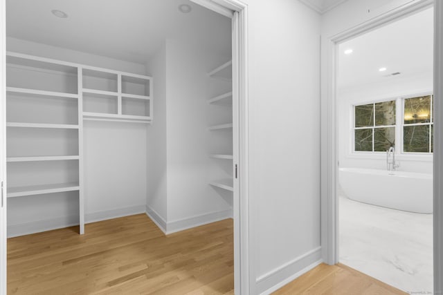 45 Robin Cir, Fairfield, CT 06824 - walk in closet with wood finished floors