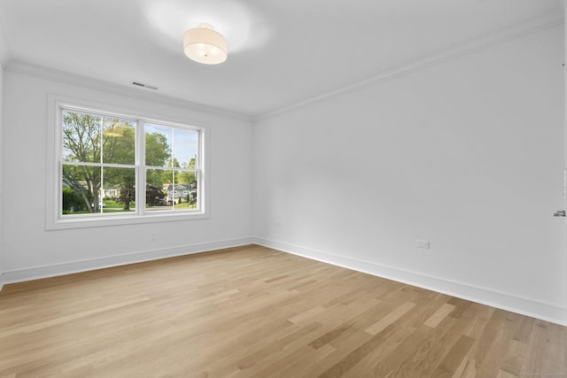 45 Robin Cir, Fairfield, CT 06824 - spare room featuring ornamental molding, light wood-type flooring, and baseboards