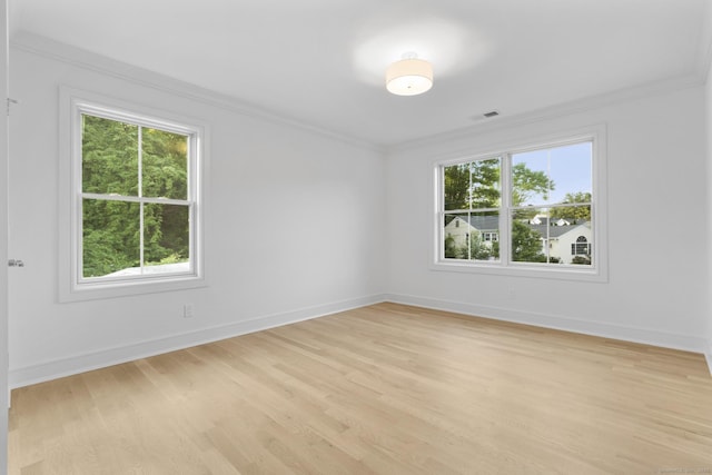 45 Robin Cir, Fairfield, CT 06824 - spare room with crown molding, light wood-style floors, and baseboards
