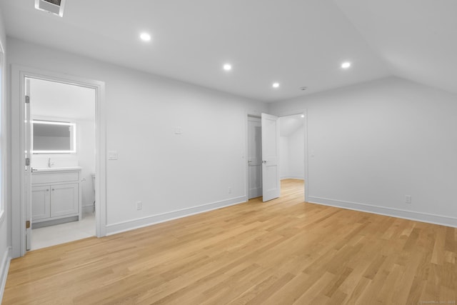 45 Robin Cir, Fairfield, CT 06824 - unfurnished bedroom with connected bathroom, recessed lighting, light wood-type flooring, baseboards, and a sink