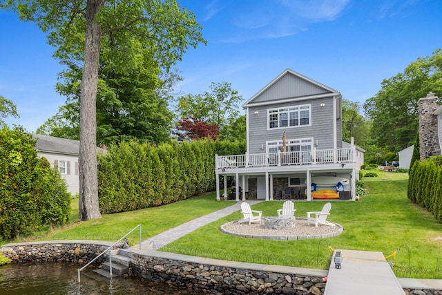 200 Perch Rock Trl, Winchester, CT 06098 - back of property featuring an outdoor fire pit, a deck with water view, a lawn, and a patio area