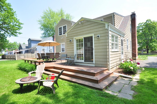 6 Lennox Ave, Windsor, CT 06095 - rear view of property with an outdoor fire pit, a chimney, a wooden deck, and outdoor dining space