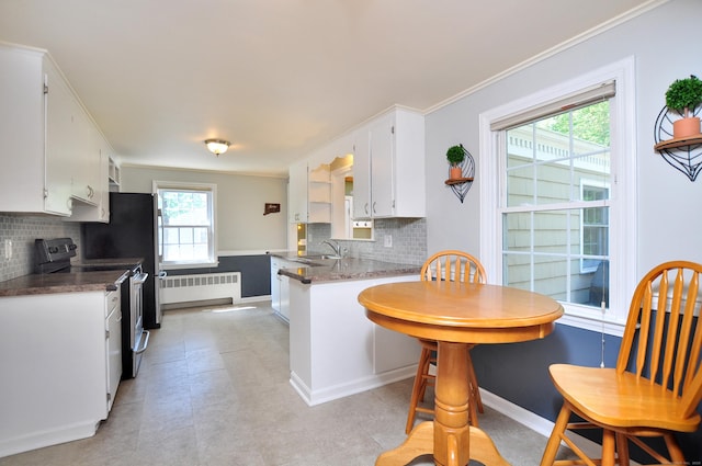 6 Lennox Ave, Windsor, CT 06095 - kitchen with stainless steel electric stove, radiator, white cabinets, tasteful backsplash, and ornamental molding